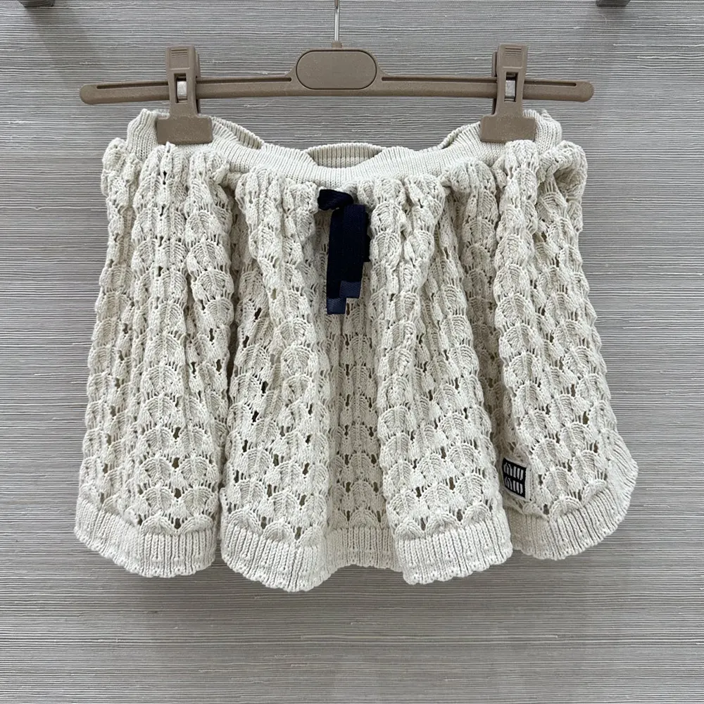 Close-up of button closure on Miu Miu Women Cotton Miniskirt-White