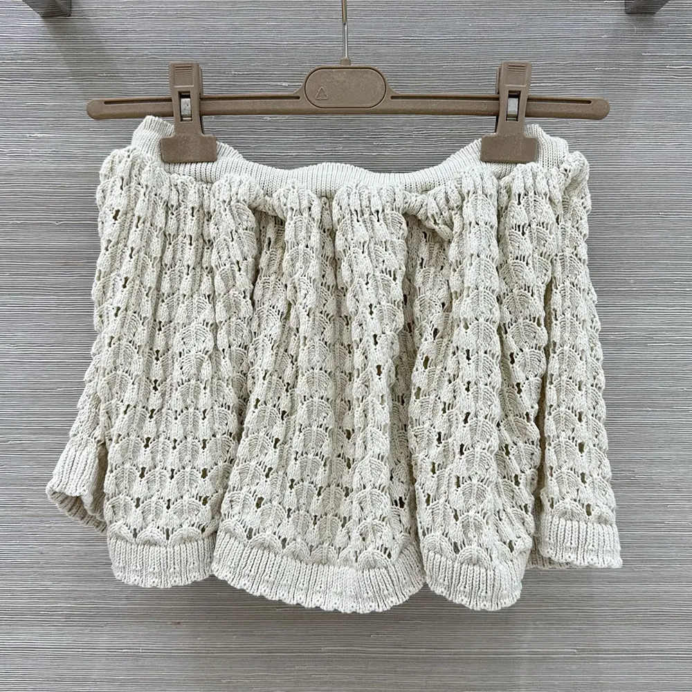 Side angle showing silhouette of Miu Miu Women Cotton Miniskirt-White