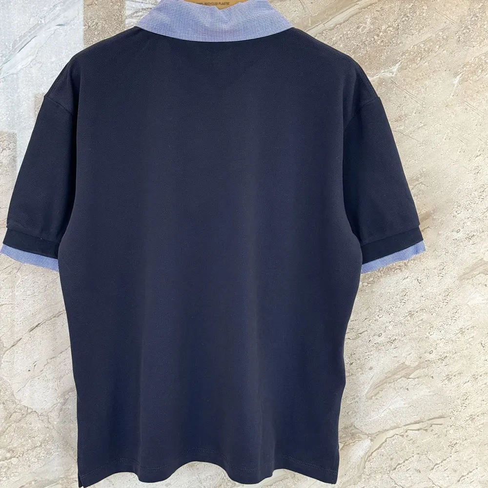 Side angle showing slim silhouette of Miu Miu Women Cotton Piqué Polo Shirt-MJN5551843