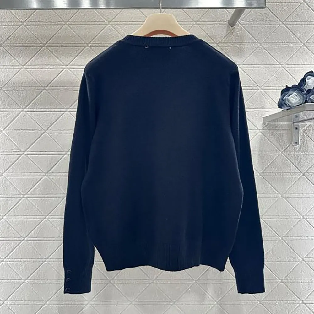 Close-up of luxurious double cashmere knit on Miu Miu sweater