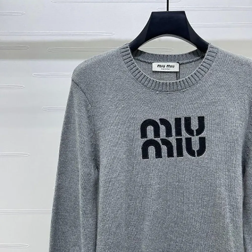 Side angle showing silhouette of Miu Miu Women Double Cashmere Sweater with Logo-Grey