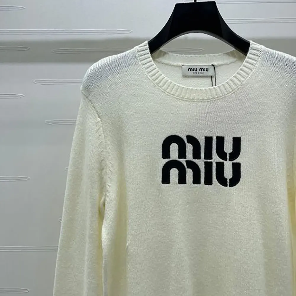 Side angle showing silhouette of Miu Miu Women Double Cashmere Sweater with Logo-White