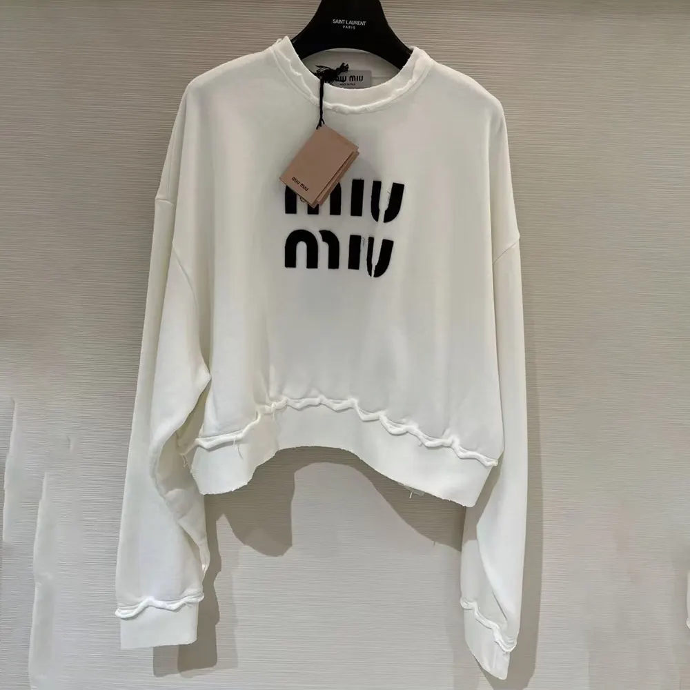 Side angle showing ribbed cuffs on Miu Miu Women Sweatshirt White
