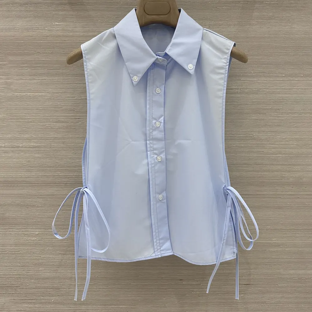 Close-up of the signature tonal buttons on Miu Miu Women Poplin Shirt-Light Blue