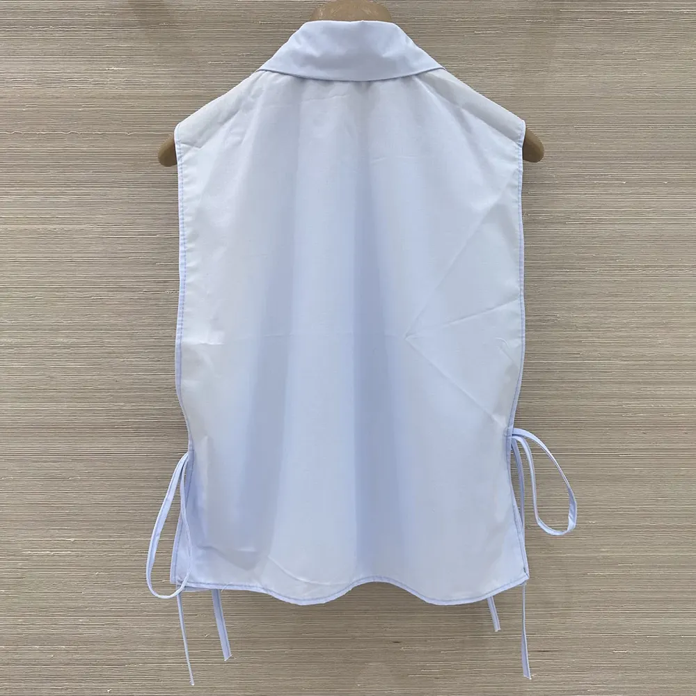 Side profile highlighting relaxed fit of Miu Miu Women Poplin Shirt-Light Blue