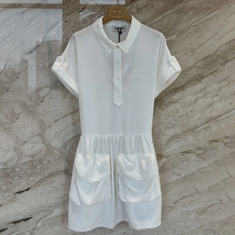 Close-up of button hardware on Miu Miu Women Slubbed Poplin Dress