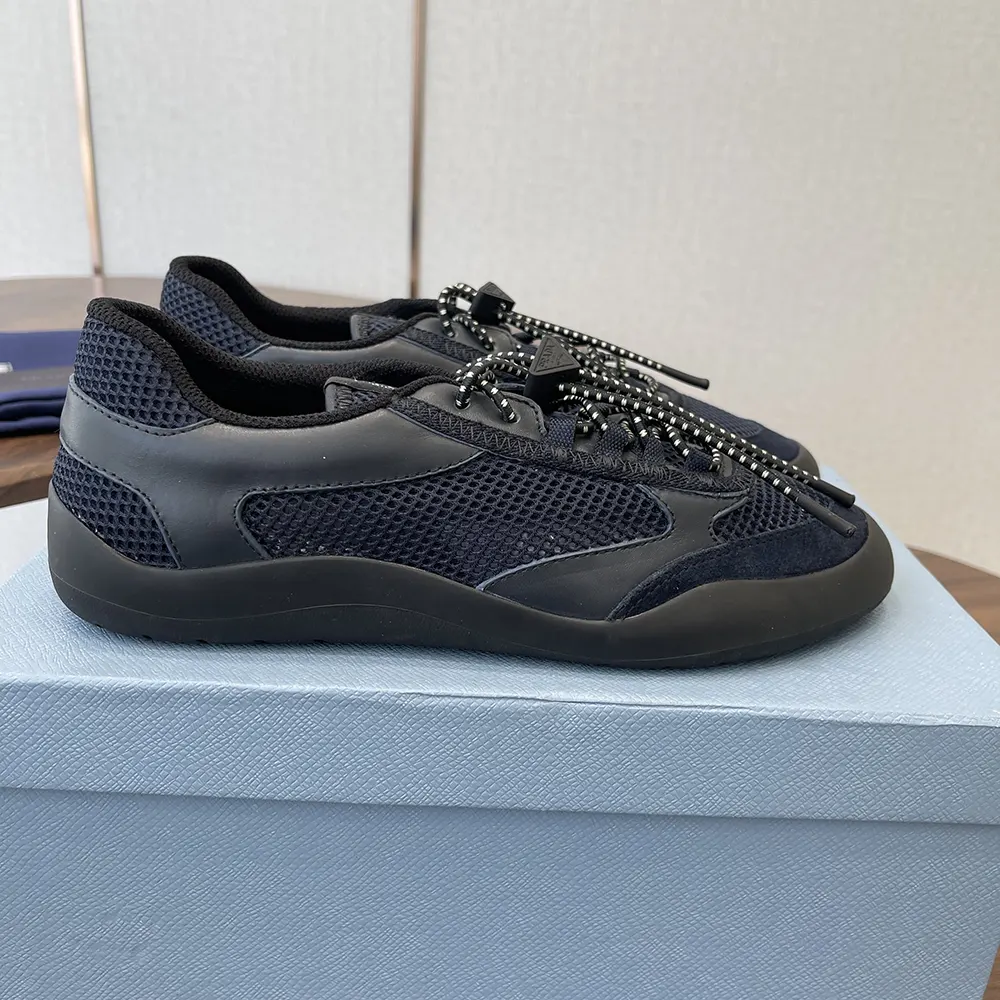 Close-up on black leather and mesh fabric of Prada Speedrock sneakers