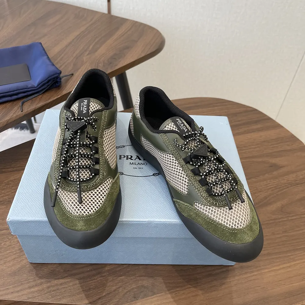 Top-down angle showing laces and signature Prada branding on sneakers