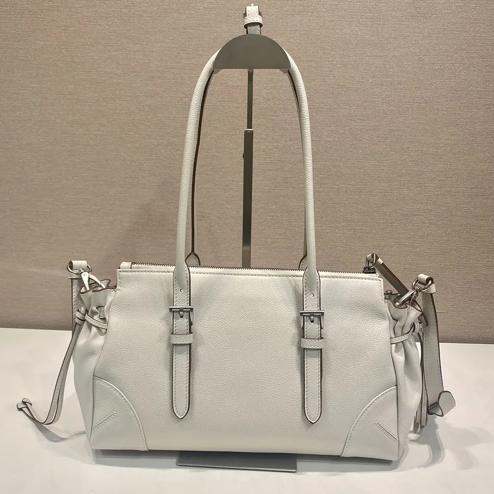 Side profile showing shape of Prada Women Bonnie Medium Antiqued Leather Tote Bag