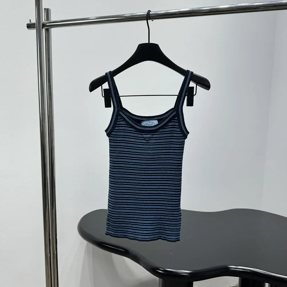 Close-up on the subtle Prada logo detail of the cotton top