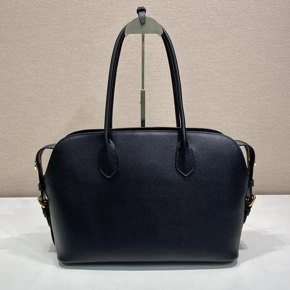 Side angle of Prada Women Large Leather Tote Bag-Black highlighting leather texture