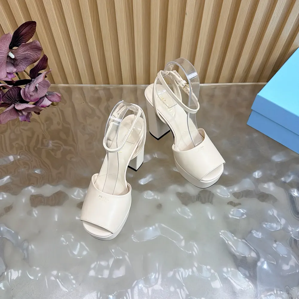 Overhead view of Prada Women Nappa Leather Platform Sandals-White paired with leather soles