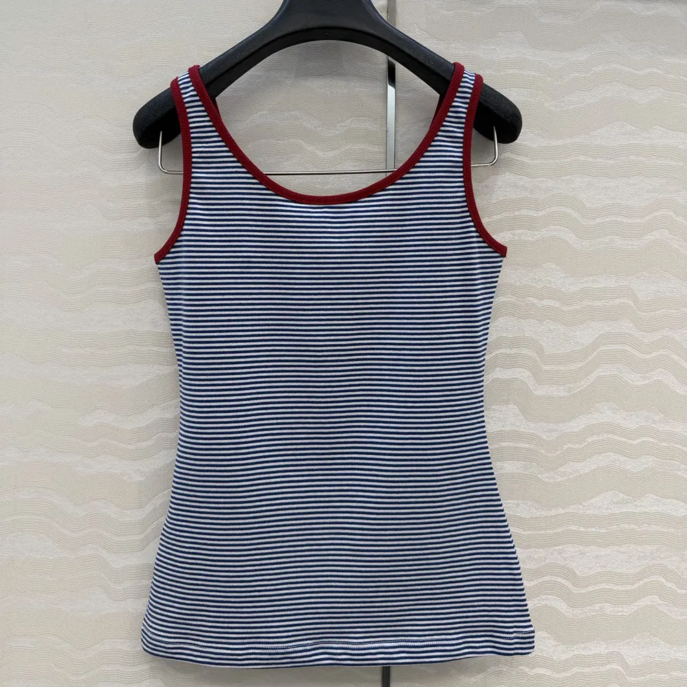 Close-up of soft cotton fabric and Prada logo embroidery on tank top