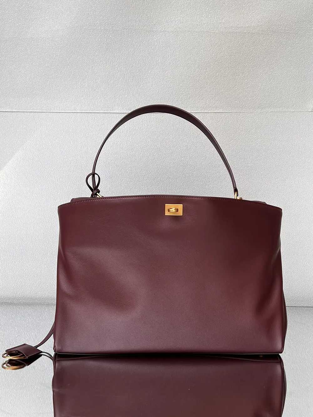 Side angle showing structured silhouette of Balenciaga Women Rodeo Handbag Large