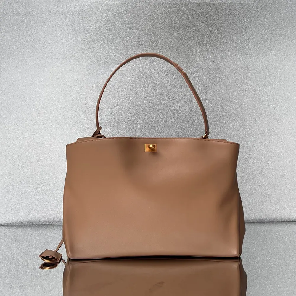 Side view showing spacious silhouette of Balenciaga Women Rodeo Handbag Large