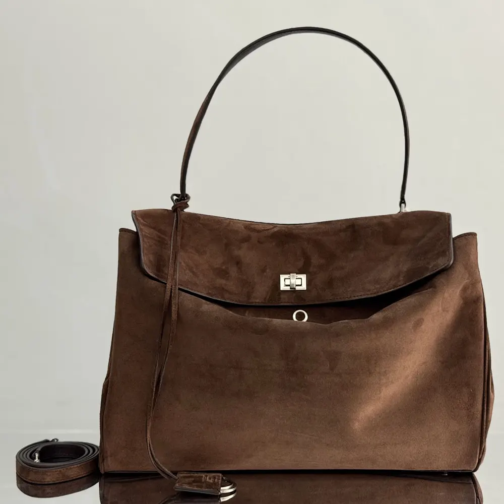 Close-up of waxed suede and smooth calfskin on Balenciaga Rodeo bag