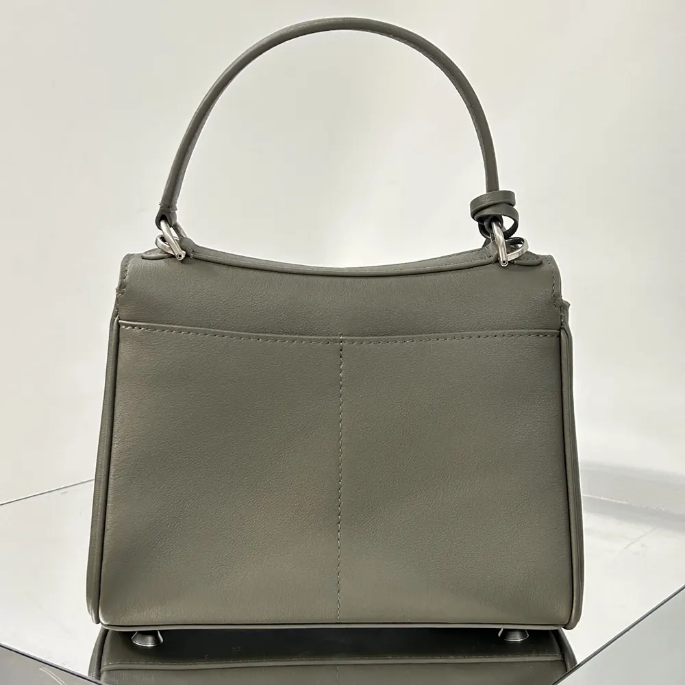 Side profile showing silhouette of Balenciaga Women Rodeo Handbag Mini in dark green