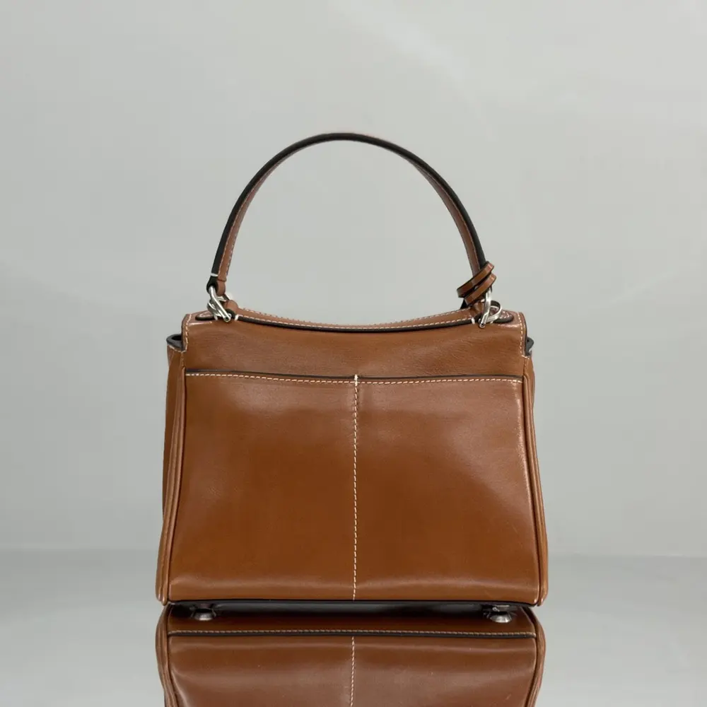 Side angle showing compact silhouette of Balenciaga Rodeo Handbag Mini