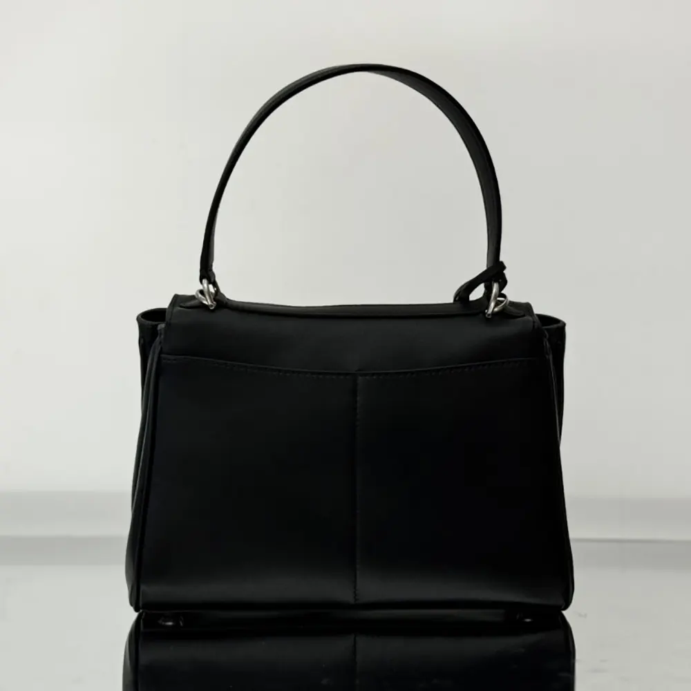 Side view showing structured silhouette of Balenciaga Women Rodeo Handbag Small