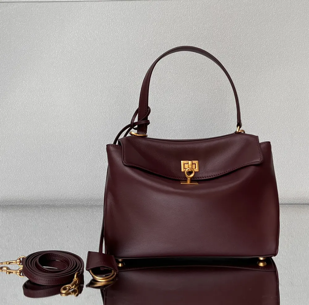 Side profile showing aged-gold hardware on Balenciaga Women Rodeo Handbag Small