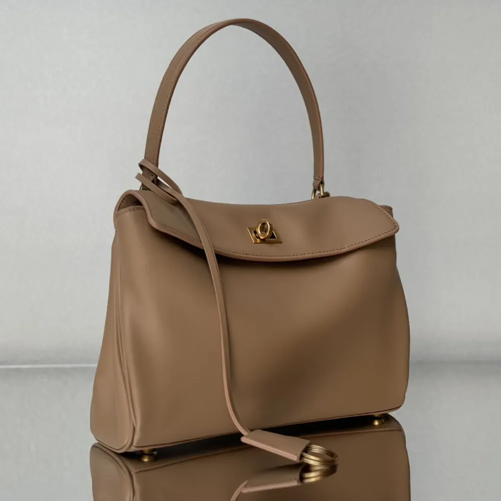 Side profile showing compact silhouette of Balenciaga Women Rodeo Handbag Small