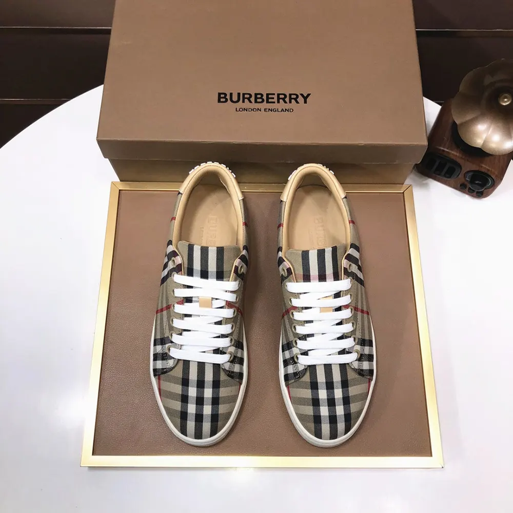 Close-up of Burberry Check pattern and leather detail on sneakers