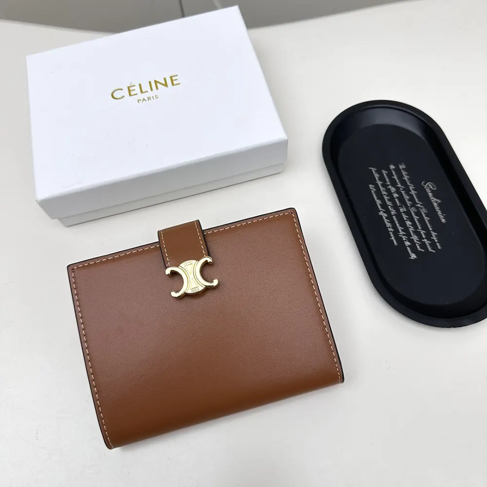 Close-up of gold-tone hardware on Celine Women Medium Strap Wallet Nino