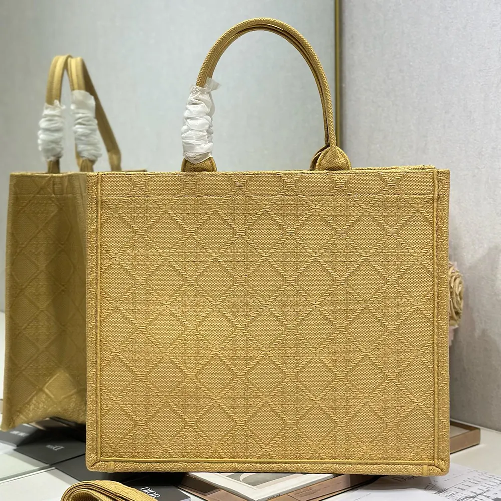 Side angle showing spacious silhouette of Dior Women Large Dior Book Tote Natural Raffia-Effect