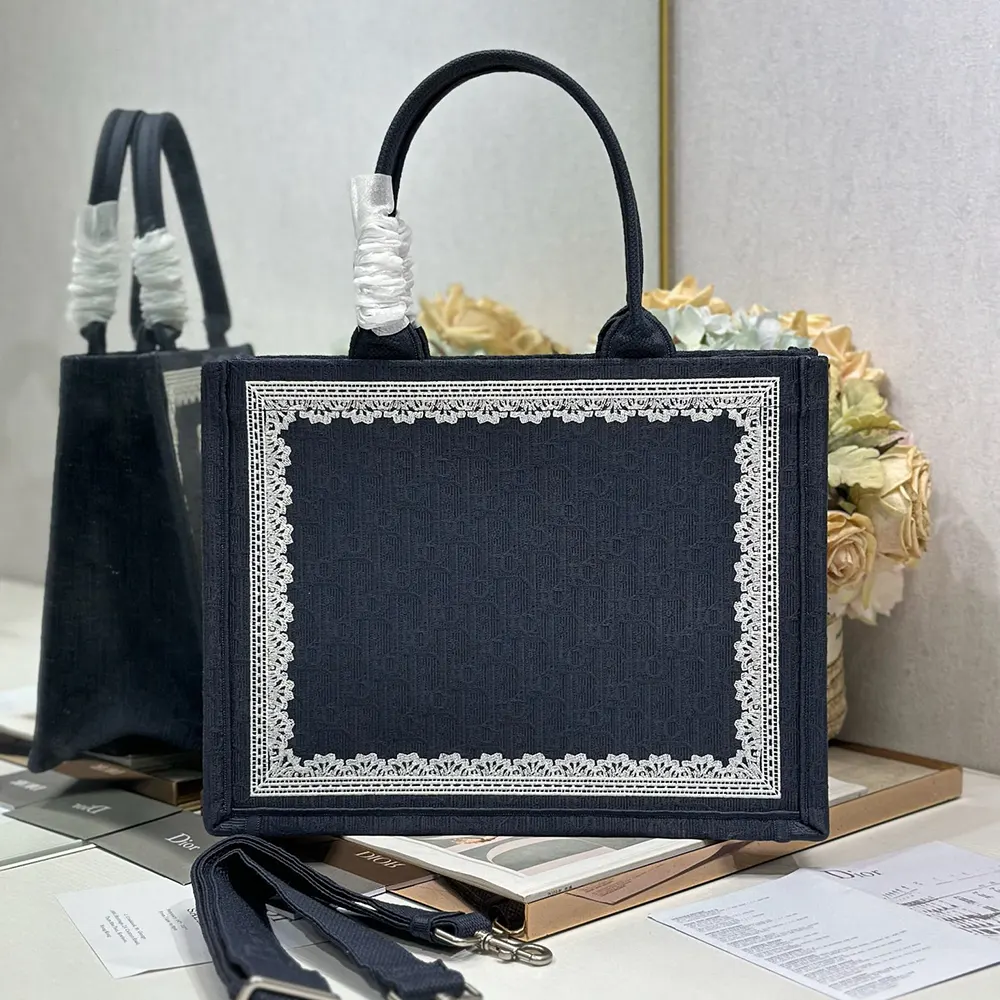 Side angle showing silver Dior Médaillon on Dior Women Medium Dior Book Tote with Strap