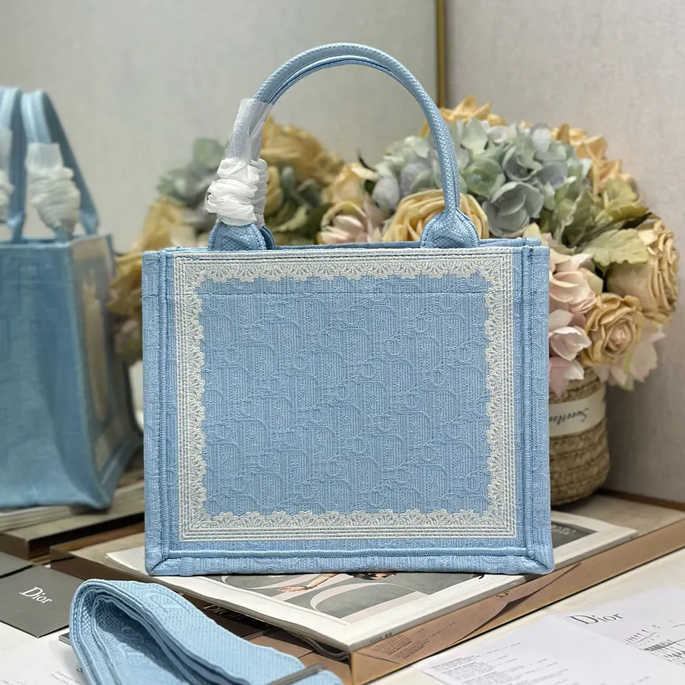 Side angle showing strap detail on Dior Women Small Dior Book Tote