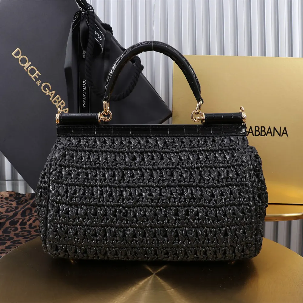Side angle showing elongated silhouette of Dolce Gabbana D&G Women Elongated Sicily Handbag-Black