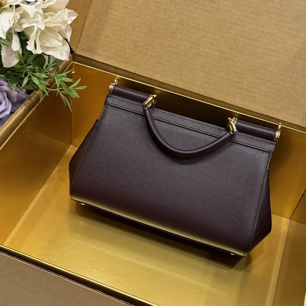 Side angle showing silhouette of Dolce Gabbana D&G Sicilia Handbag purple