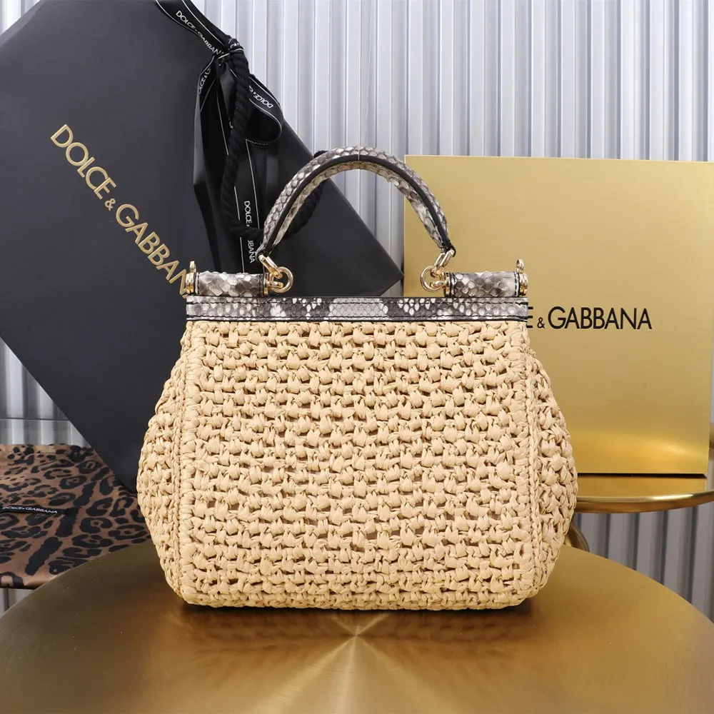 Side angle showing structured silhouette of Small Sicily Handbag by Dolce Gabbana