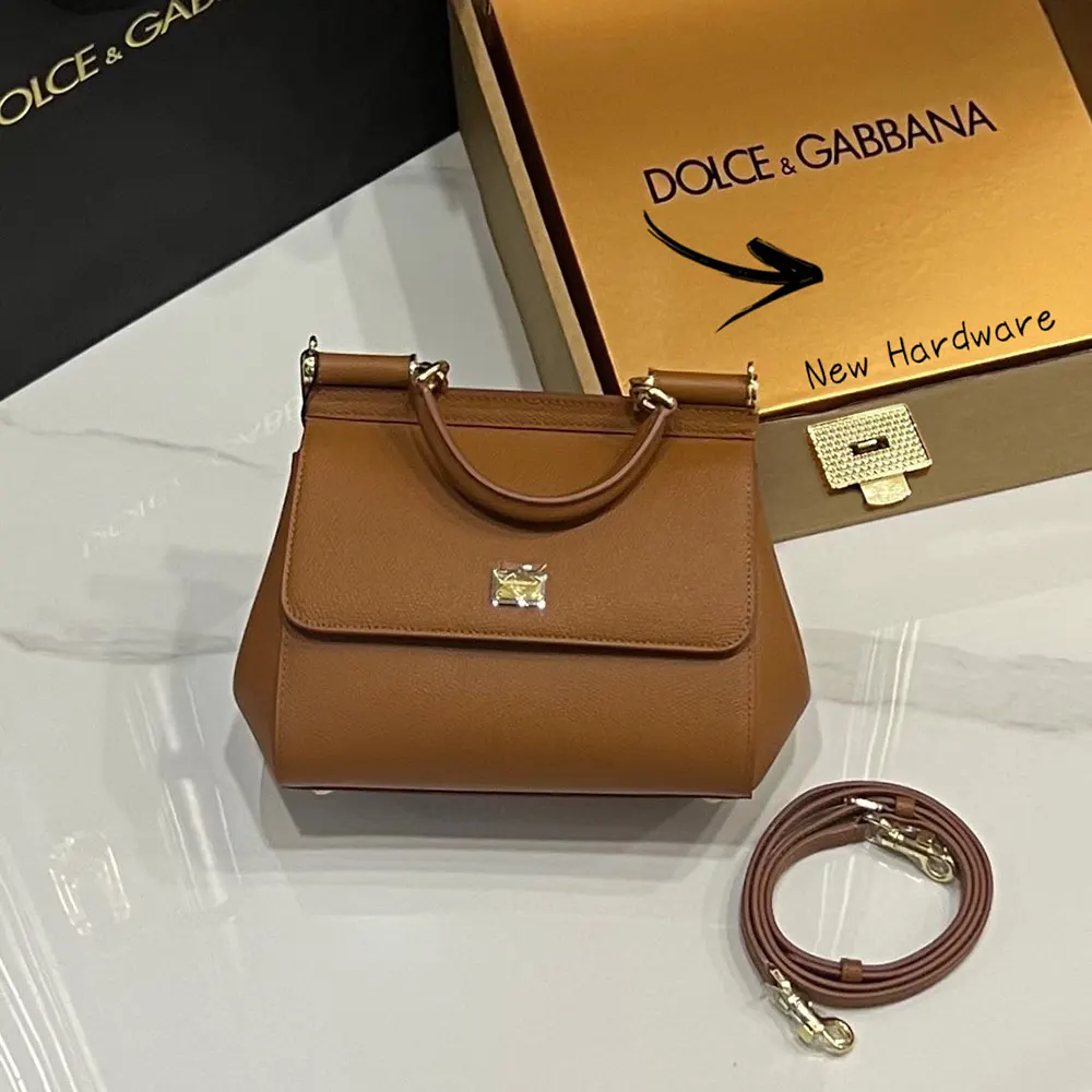 Close-up of gold hardware and D&G logo on small Sicily handbag