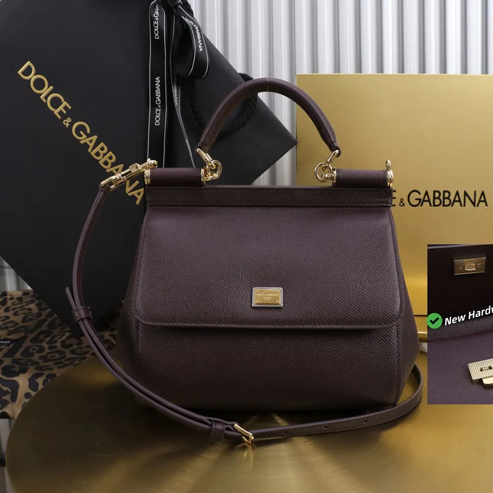 Side angle showing adjustable strap and textured leather on Dolce Gabbana D&G handbag