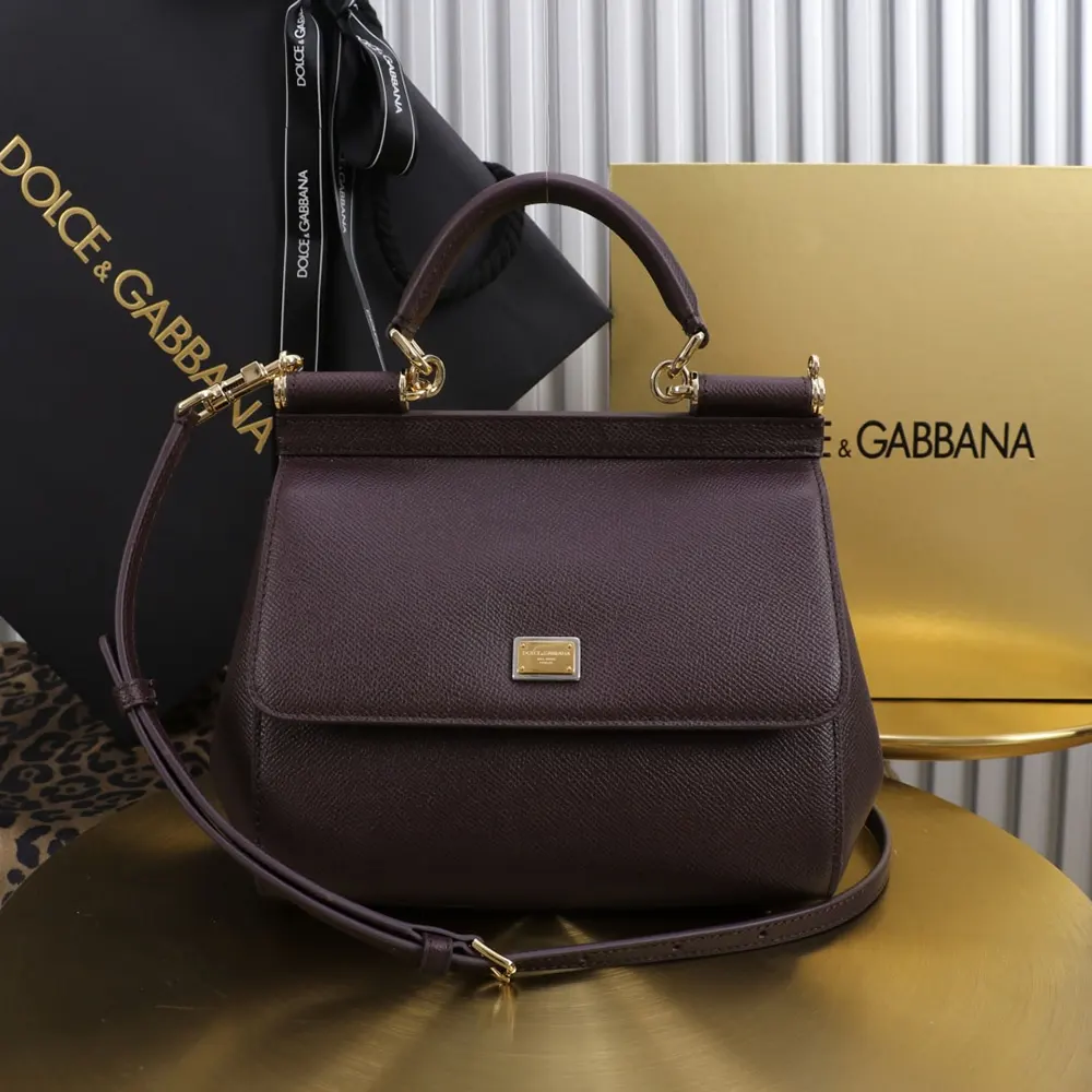 Close-up of gold-tone push-lock and embossed D&G logo on small Sicily handbag