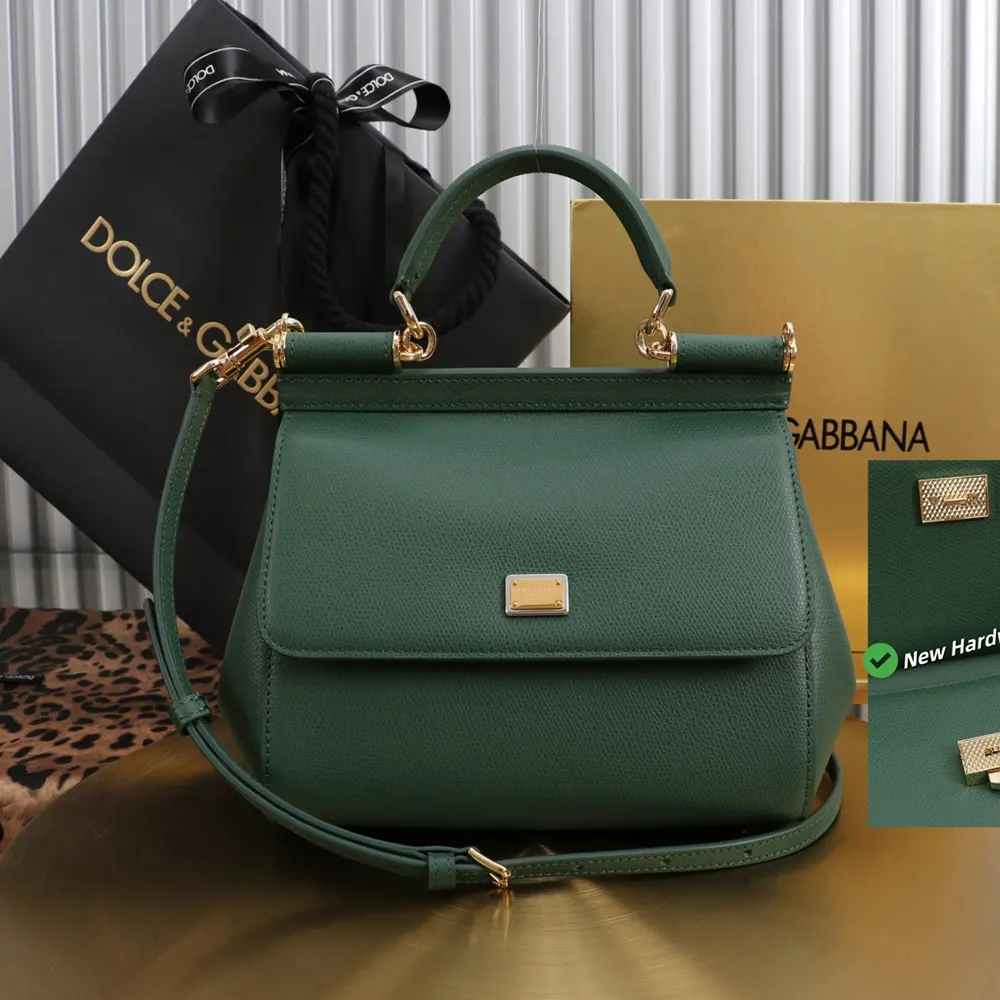 Close-up on gold DG logo hardware of Sicily Handbag in Dauphine calfskin