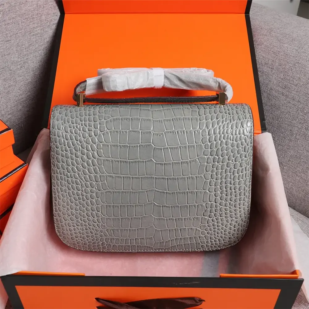 Side angle showcasing matte alligator texture on Hermes Constance 18 bag