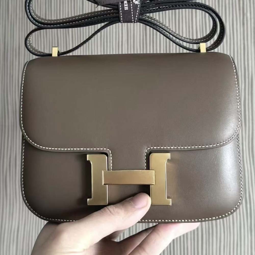 Close-up of gold ‘H’ clasp on Hermes Women Constance 19 Bag