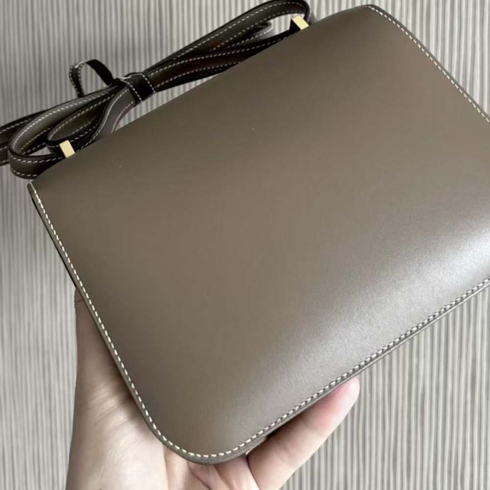 Side angle showing slim profile of Hermes Women Constance 19 Bag