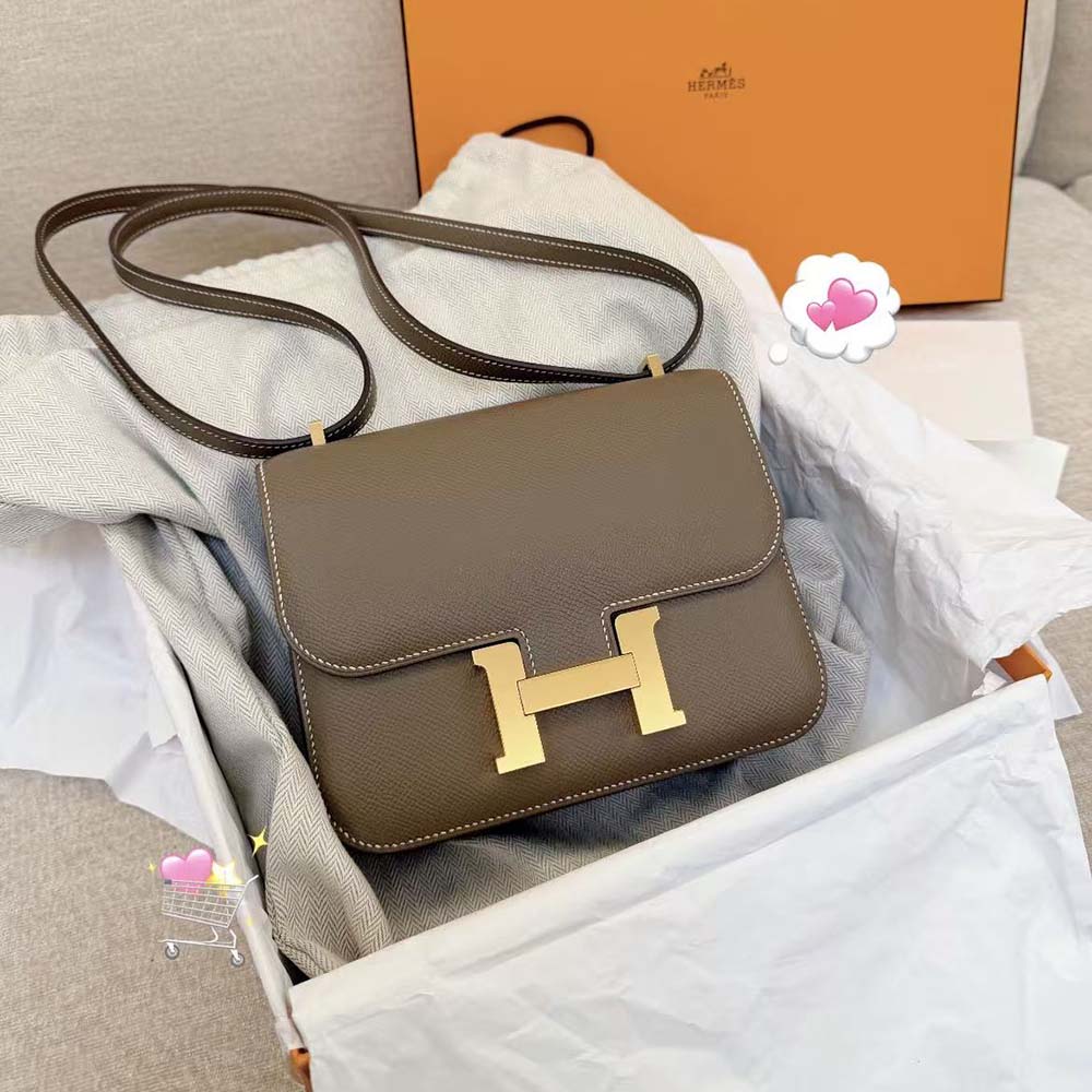 Close-up of gold Constance H clasp on Hermes Women Constance 19 Bag