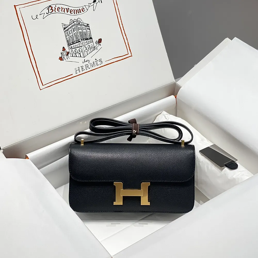 Close-up of gold H clasp on Hermes Women Constance Elan Epsom Gold-Black