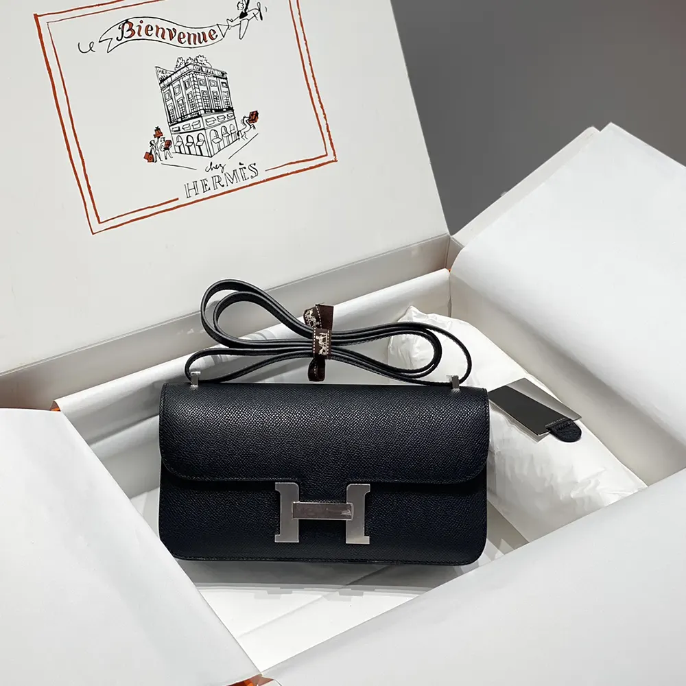 Side profile showing structure of Hermes Women Constance Elan Epsom Silver-Black