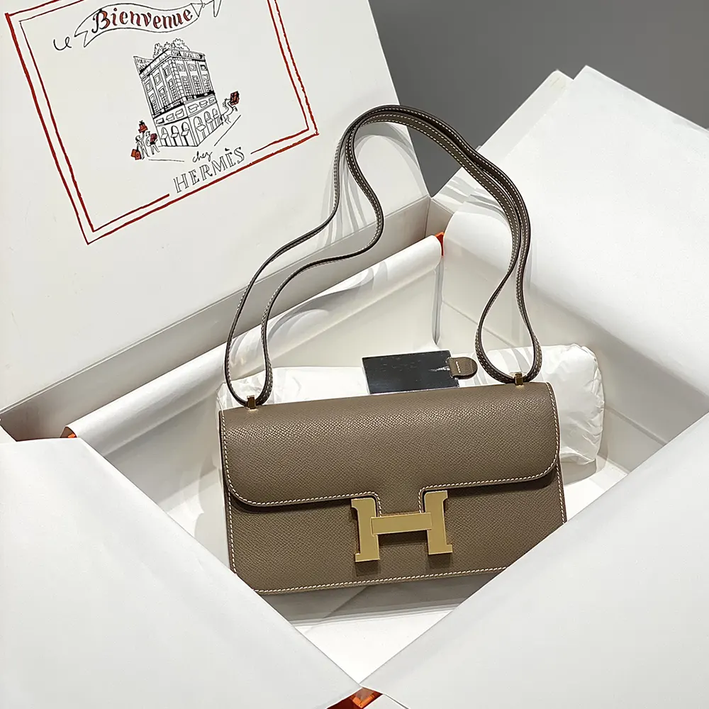 Close-up of gold-tone clasp on Hermes Women Constance Elan Epsom Gold-Gray