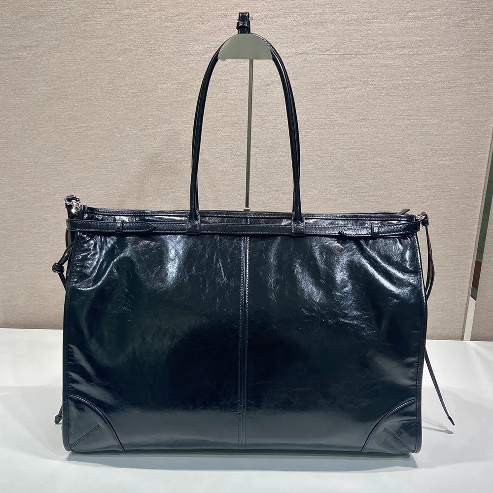 Side angle showing structured silhouette of Prada Unisex Bonnie Leather Tote Bag