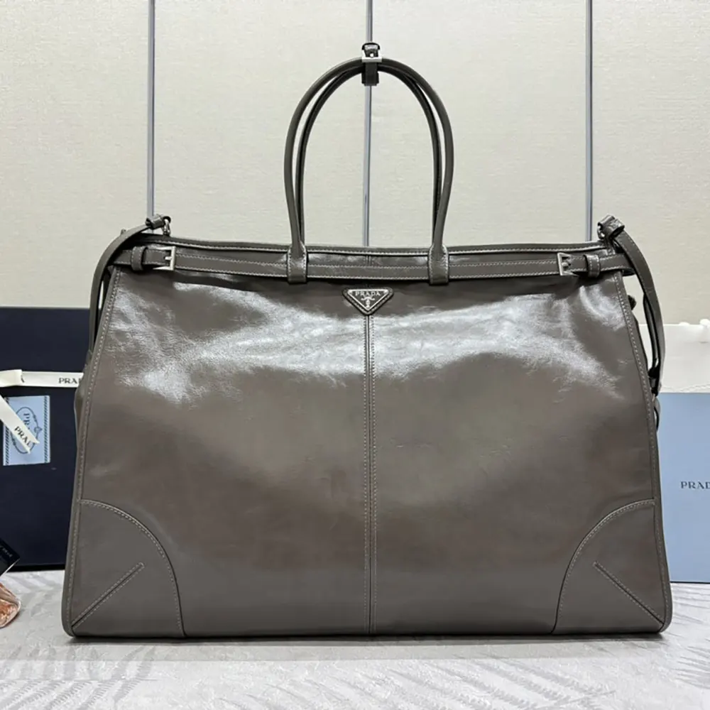 Close-up of silver hardware detail on Prada Unisex Bonnie Leather Tote Bag-Clay