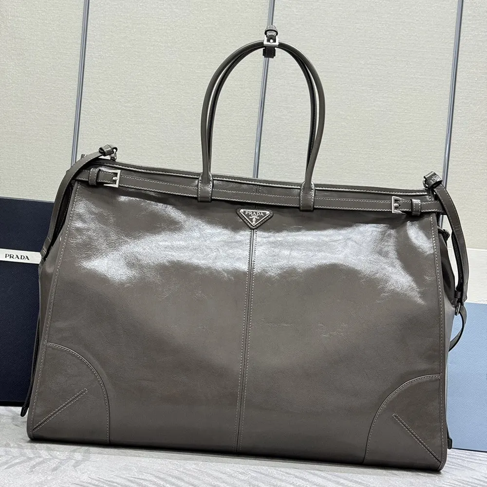 Side profile of spacious Prada Unisex Bonnie Leather Tote Bag-Clay with zip closure