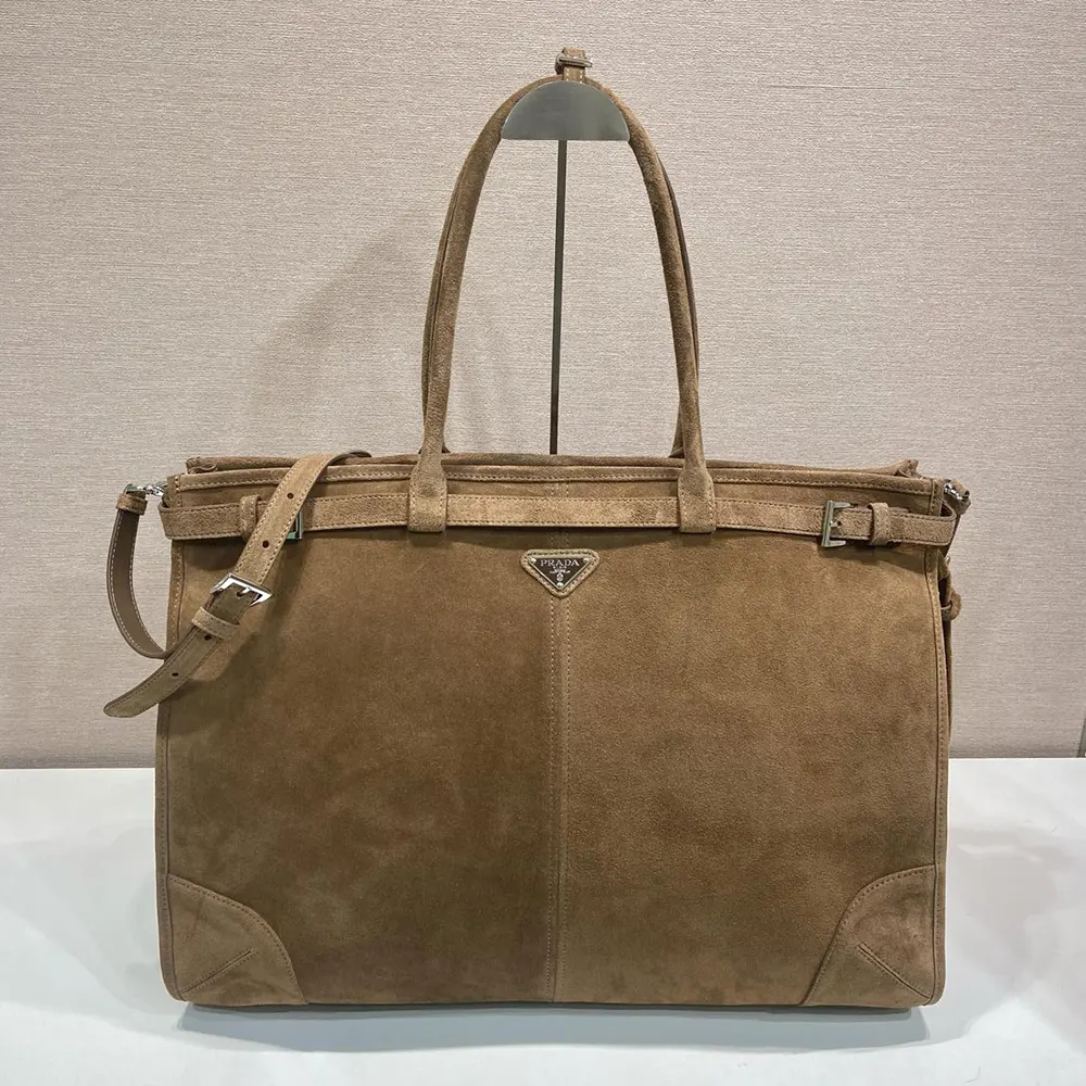 Close-up of gold-tone hardware on Prada Unisex Bonnie Suede Tote Bag-Cinnamon