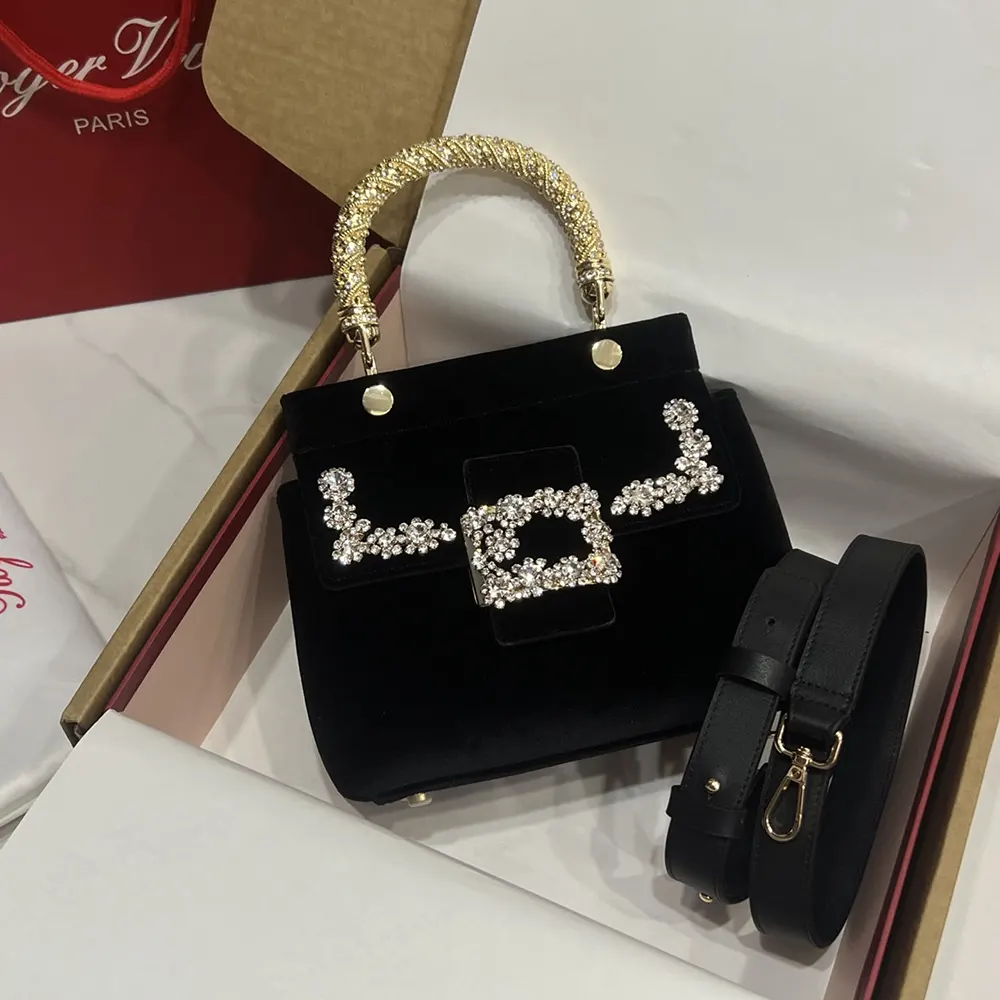 Close-up of jewel floral closure on Roger Vivier Velvet-Black Mini Bag
