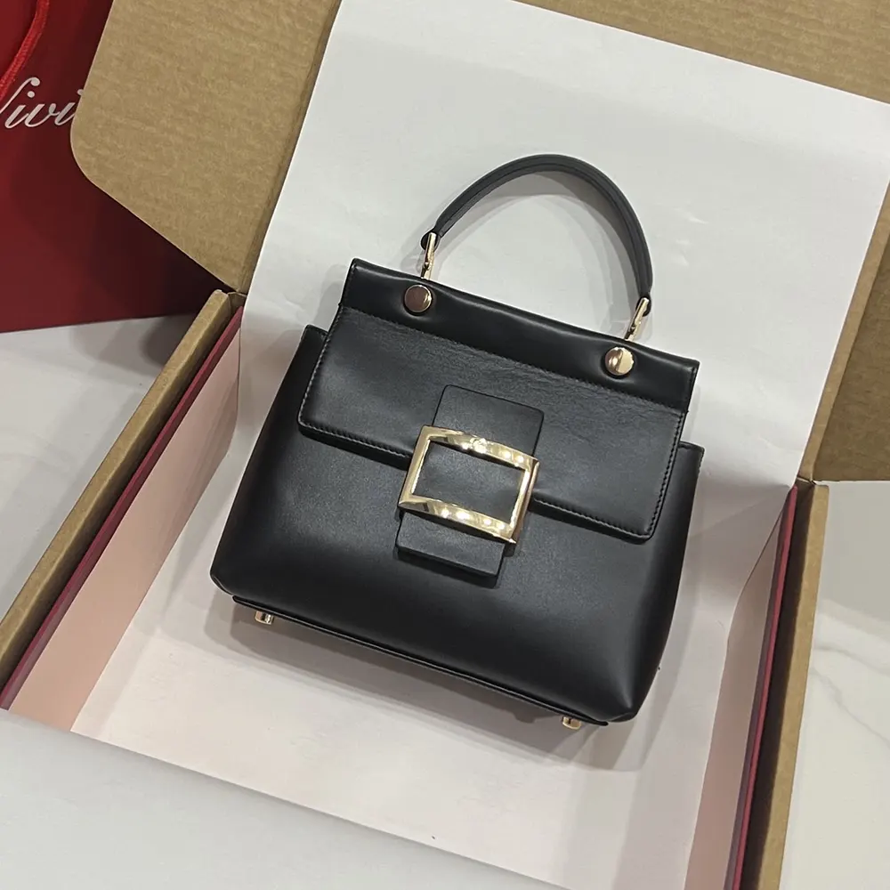 Side profile showing structured leather and strap of Viv’ Cabas Bag